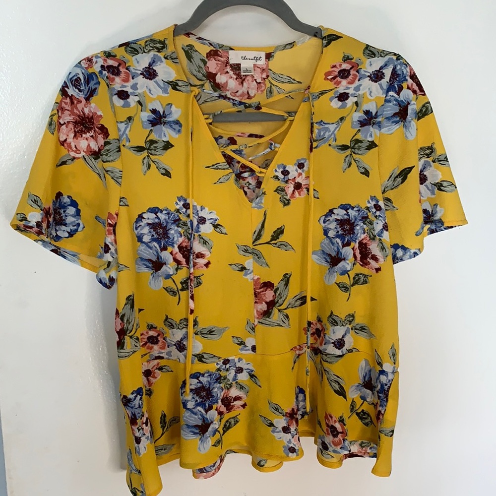 Yellow floral blouse.